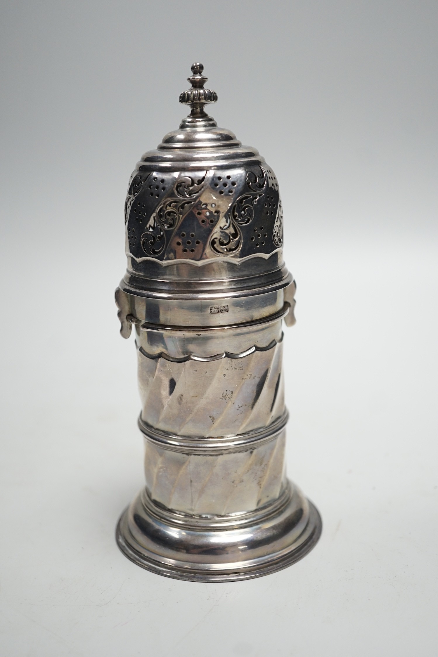 An Edwardian silver lighthouse sugar caster, with spiral body, by Nathan & Hayes, Chester, 1908, 18cm, 8.3oz.